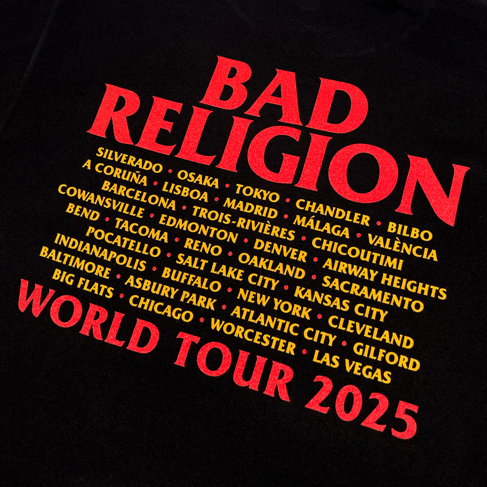 Close up of a black t-shirt with red and yellow text reading "BAD RELIGION WORLD TOUR 2025" along with city names from the 2025 tour