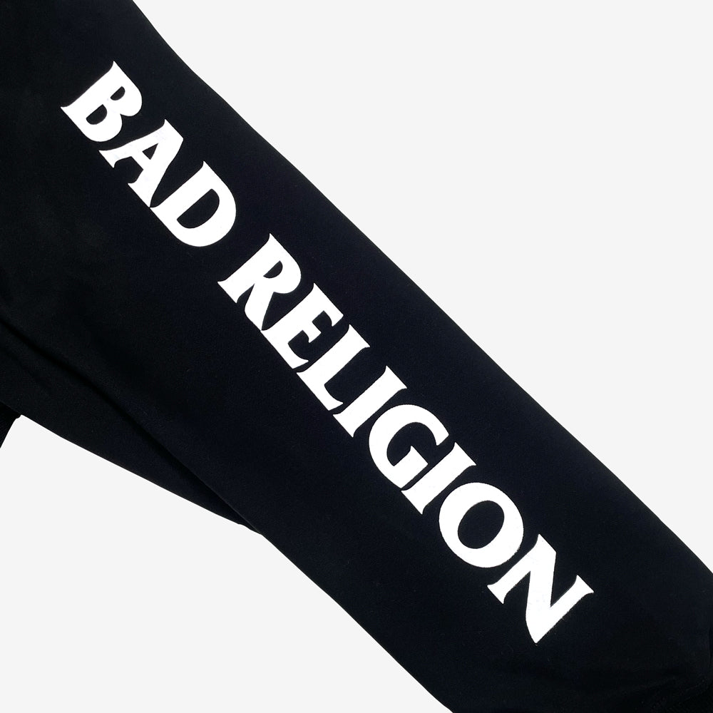 Close up of a black sleeve with white text reading "BAD RELIGION" against a white background.