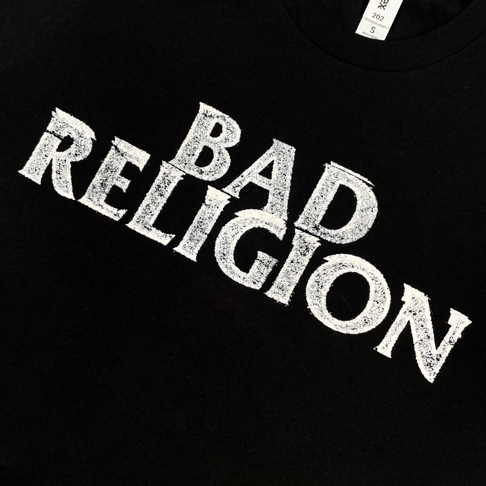 Close up of a front print of black Bad Religion t-shirt with typography reading "Bad Religion"