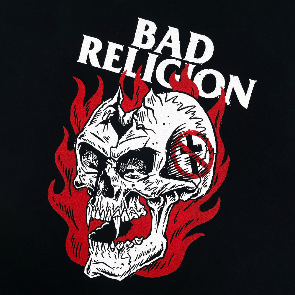 Close up of a black t-shirt with flaming skull graphic and text reading "BAD RELIGION"