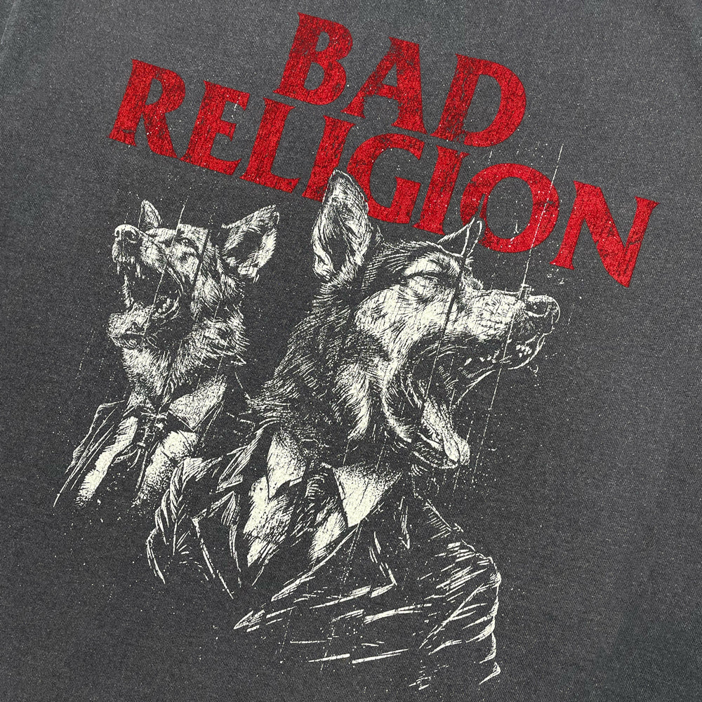 Grey t-shirt with graphic of two dogs in suits and text reading "BAD RELIGION" against white background