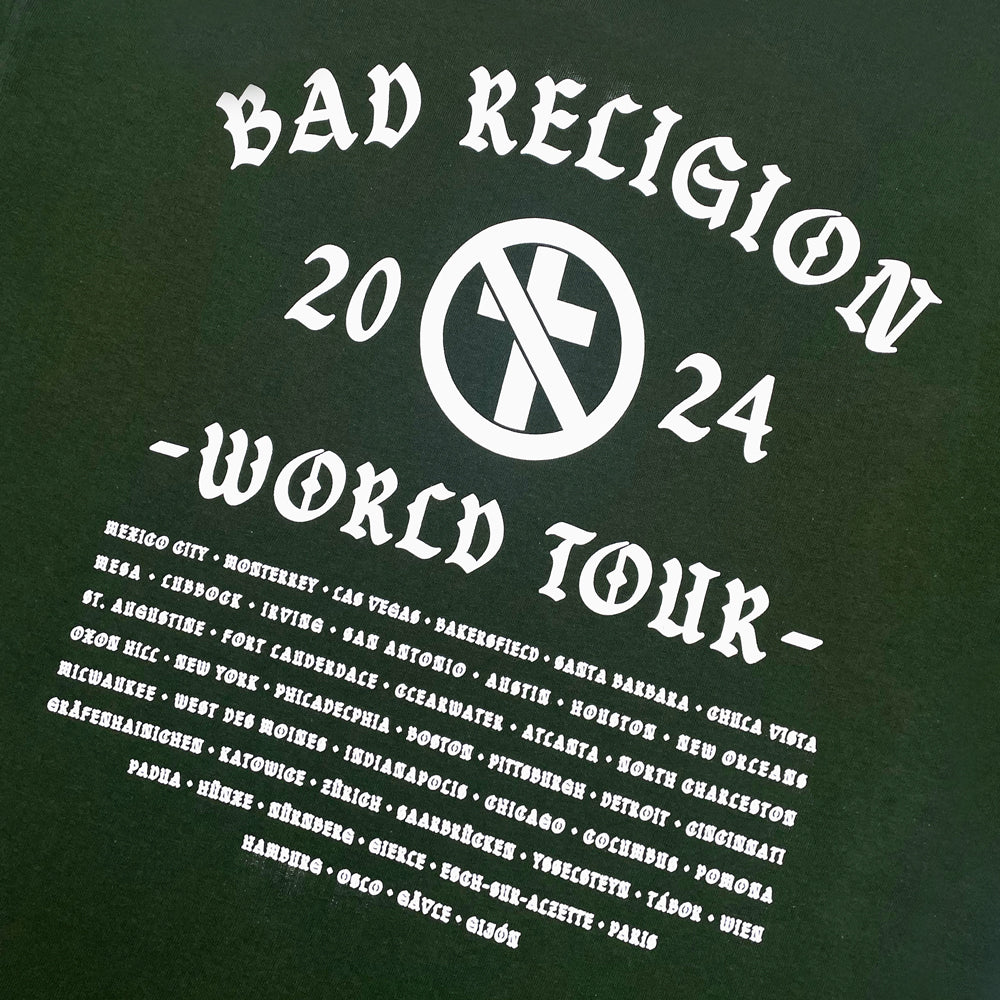 Close up of a back print of green Bad Religion tee with crossbuster logo and text reading "Bad Religion 2024 World Tour" followed by a list of cities from the 2024 tour