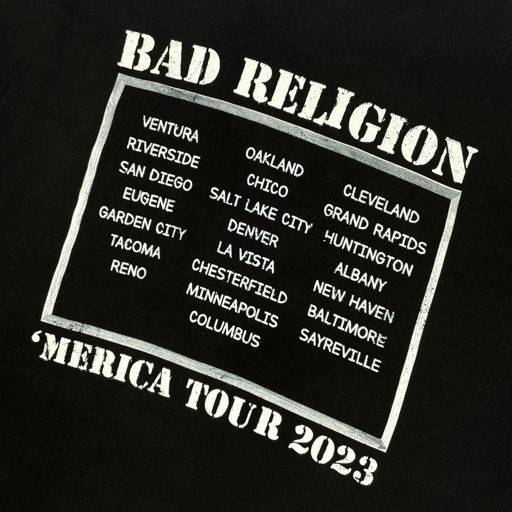 Close up of a back print of black Bad Religion t-shirt with text reading "Bad Religion 'Merica Tour 2023" along with a list of cities from the 2023 tour