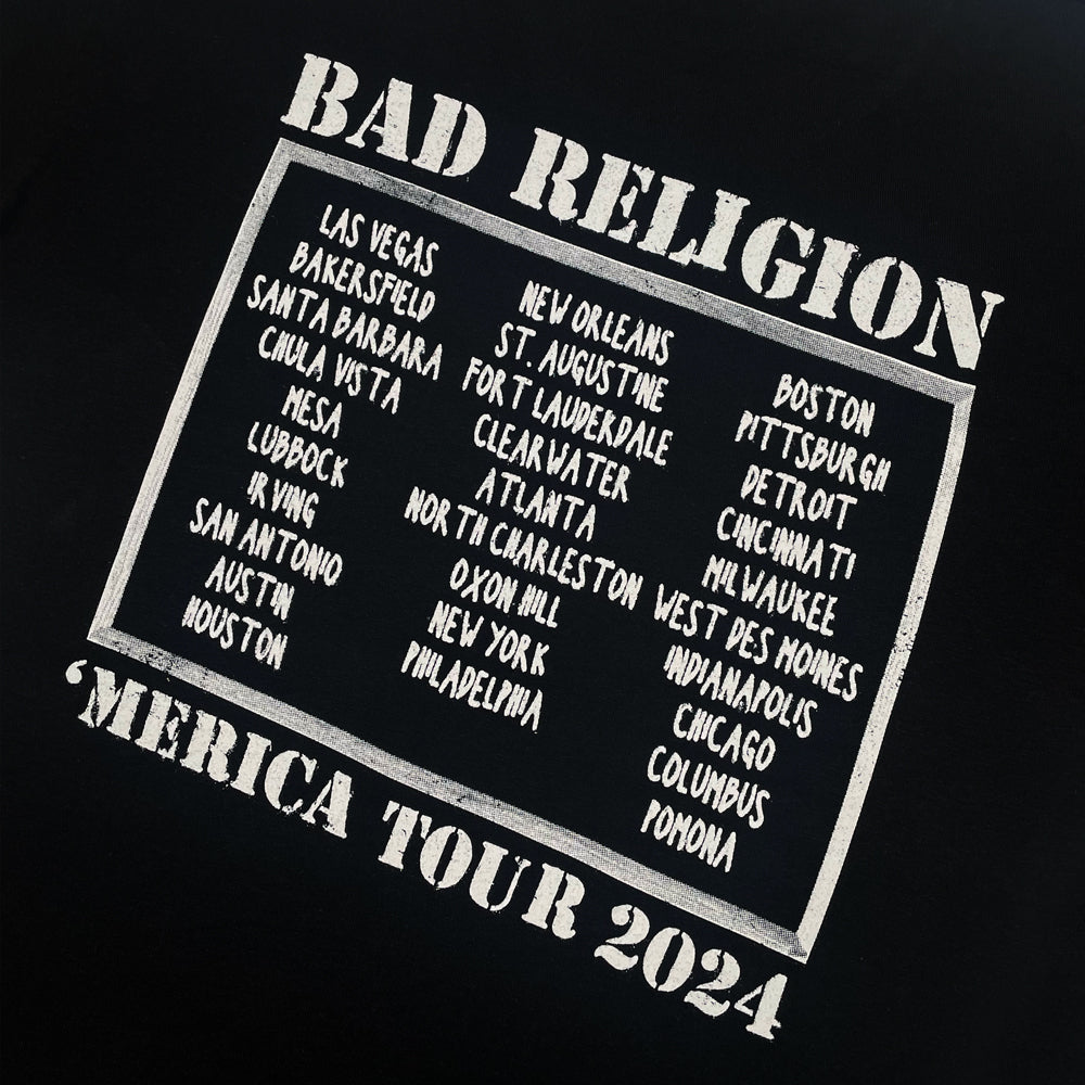 Close up of the back print of black Bad Religion t-shirt with text reading "Bad Religion 'Merica Tour 2024" along with a list of cities from the 2024 tour
