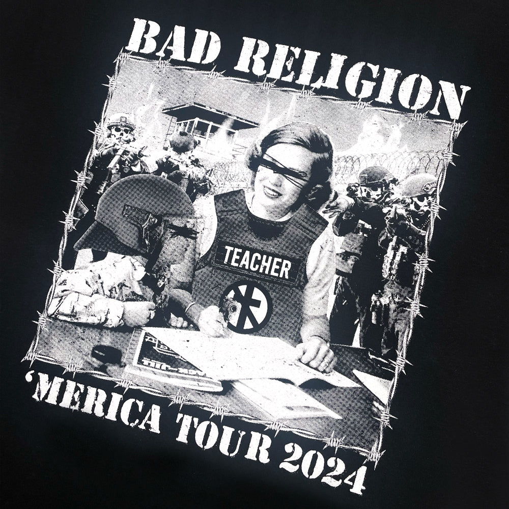 Front print of black Bad Religion t-shirt with graphic of a teacher surrounded by men pointing a gun at them. Graphic is surrounded by lettering reading "Bad Religion 'Merica Tour 2024"