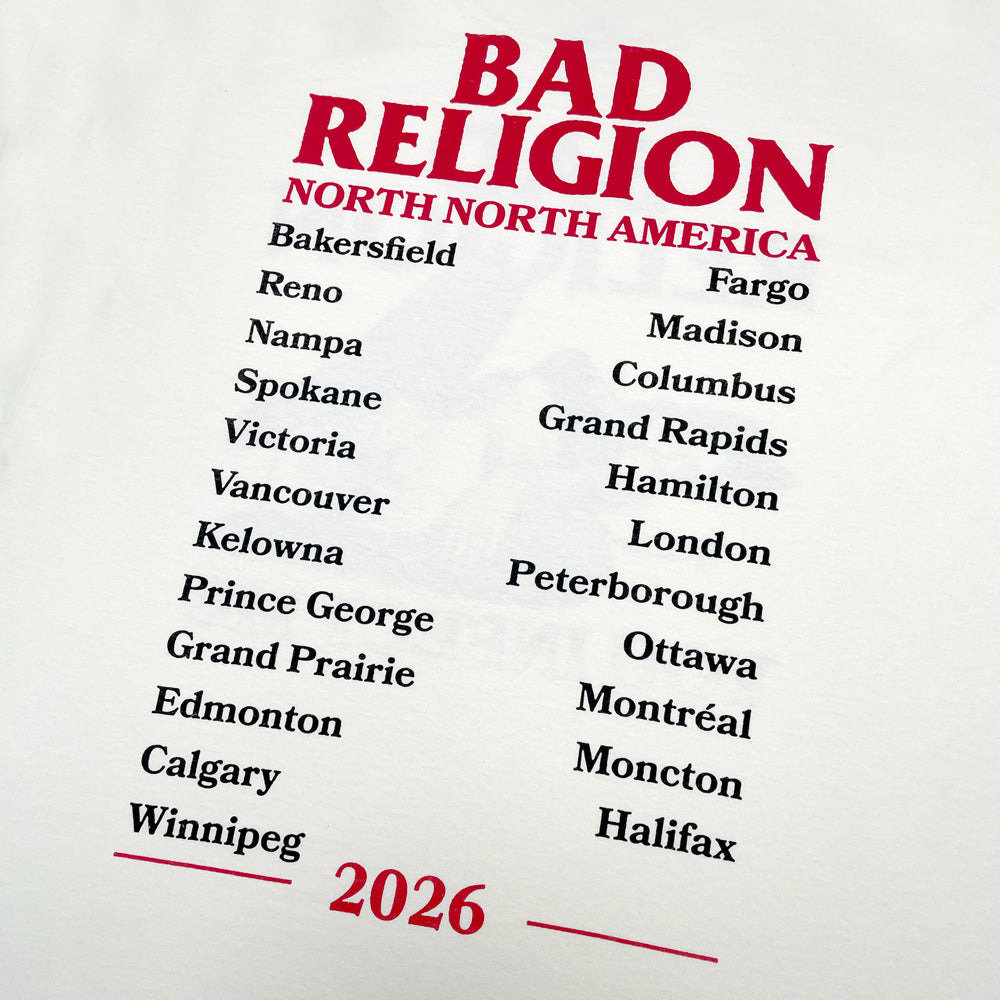 Close up of the back of a cream colored tee with Red text reading "Bad Religion North North America" followed by a list of the 2026 tour cities in black text. Below the city list in red text is "2026"
