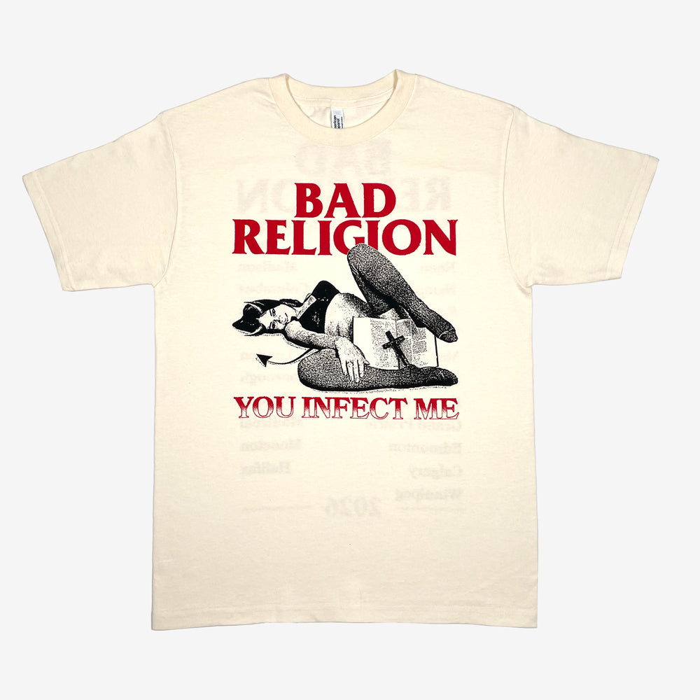 Cream t-shirt with graphic of a woman with devil horns holding a bible and cross surrounded by text reading "BAD RELIGION YOU INFECT ME" against a white background