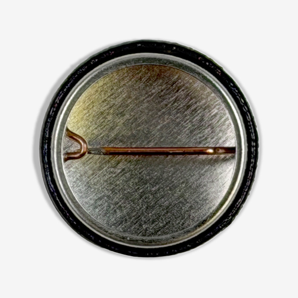 Back view of Eddie Vedder Surf Association Button showing traditional metal pin-back closure.