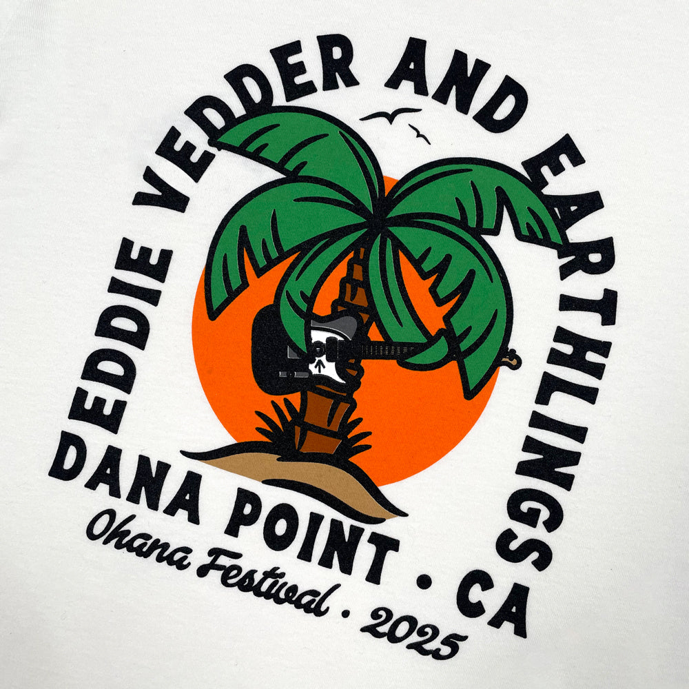 Close up of a white tee with a design of a palm tree playing a telecaster guitar. Black text arches over the palm tree reading "Eddie Vedder and Earthlings" below is black text reading "Dana Point CA Ohana Festival 2025"