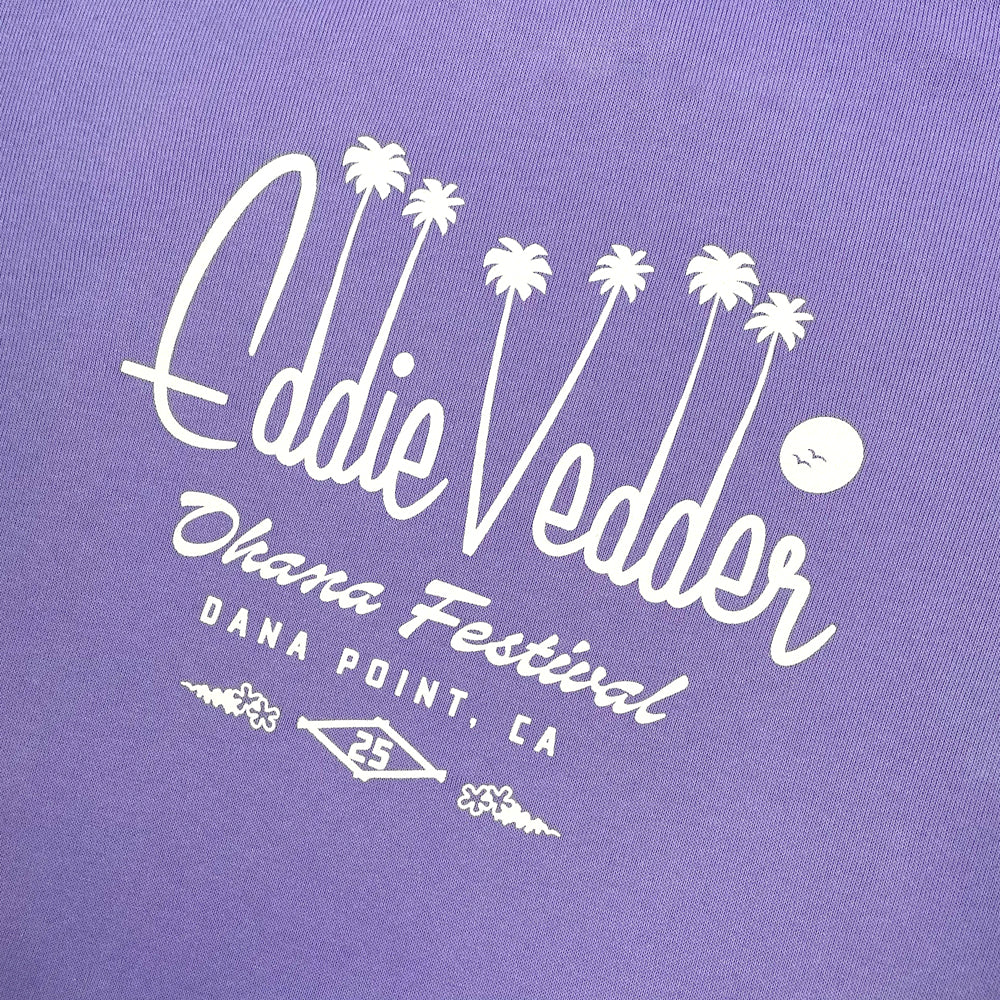 Close up of a purple hoodie from the back with typography reading "Eddie Vedder Ohana Festival Dana Point, CA 25"