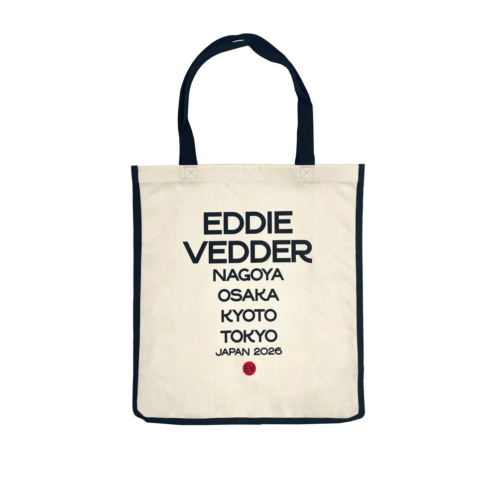 A natural tote bag with a black outline and black handles against a white background. In black text it reads "Eddie Vedder, Nagoya, Osaka, Kyoto, Tokyo, Japan 2026" At the bottom of the text is a small red circle with black text reading "EV" in the center.
