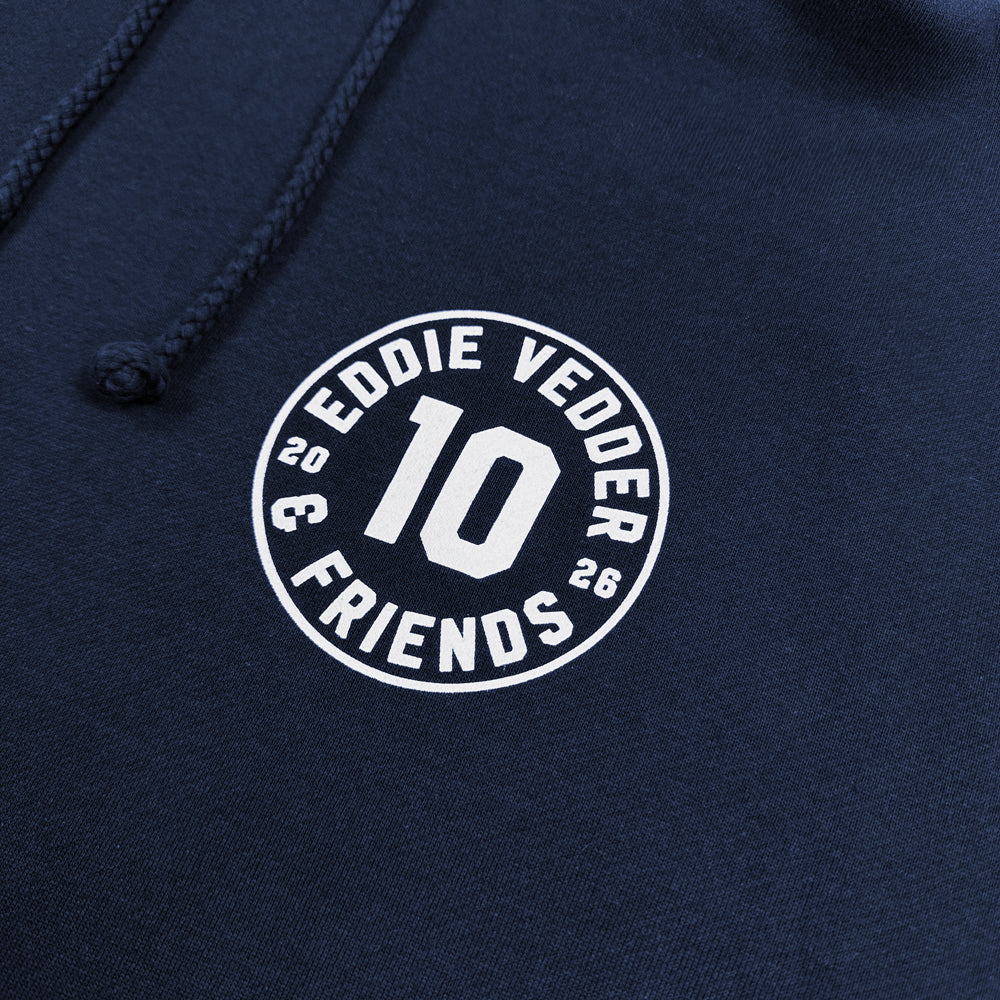Close-up of white number 10 Eddie Vedder & Friends chest graphic on navy hoodie
