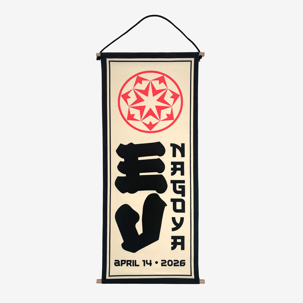 A wall scroll against a white background. At the top of the scroll is a light red circular design. In the middle is large black text reading "EV" and to the right of that is black text reading "Nagoya" At the bottom in black text there is a date that reads "April 14, 2026"