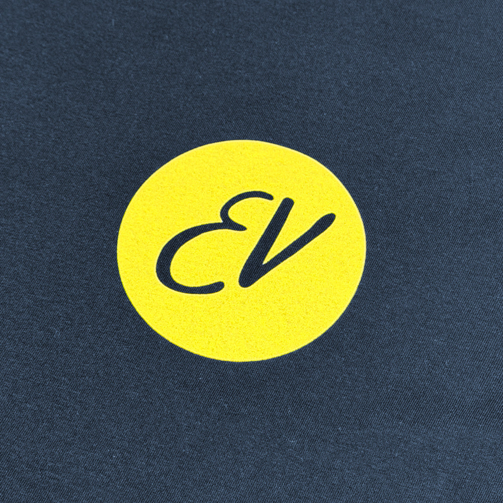 Close-up of yellow EV circle chest graphic on navy Eddie Vedder Wave Tee
