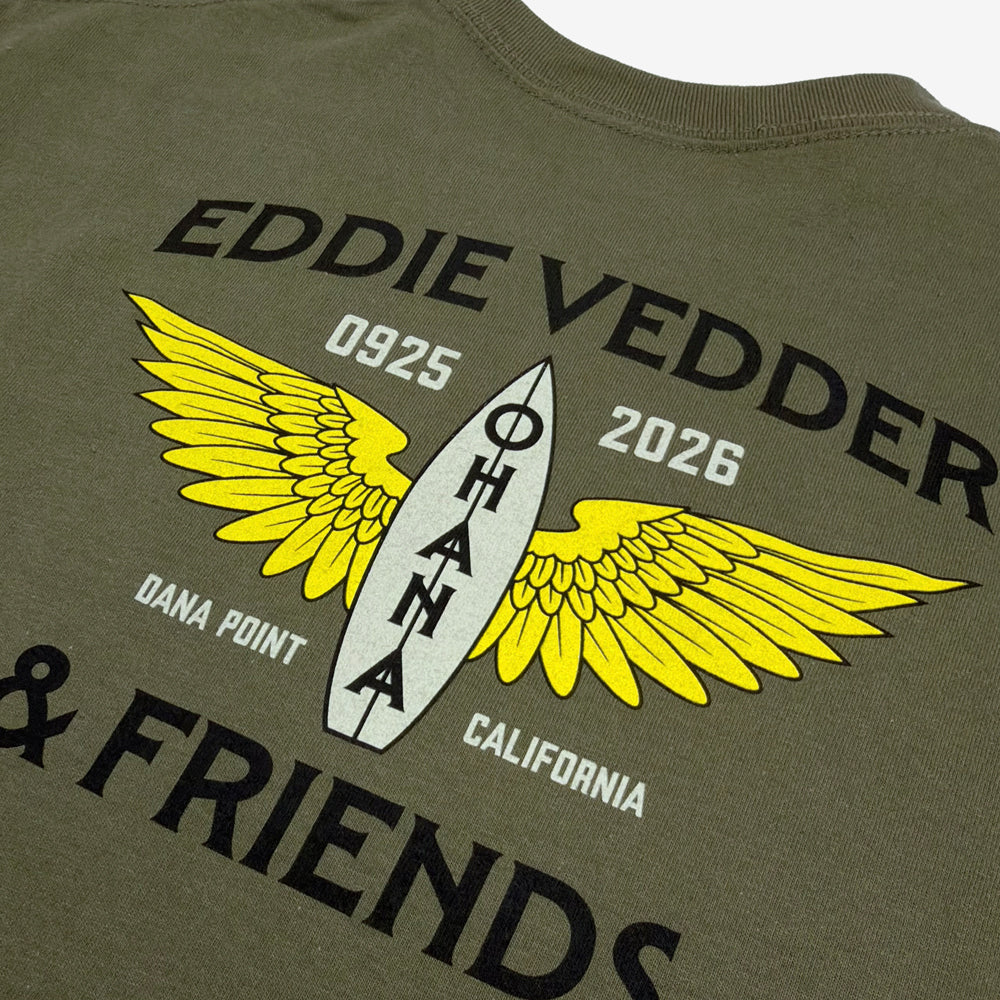 Close-up of yellow winged Ohana surfboard graphic on Eddie Vedder military green Wings Tee