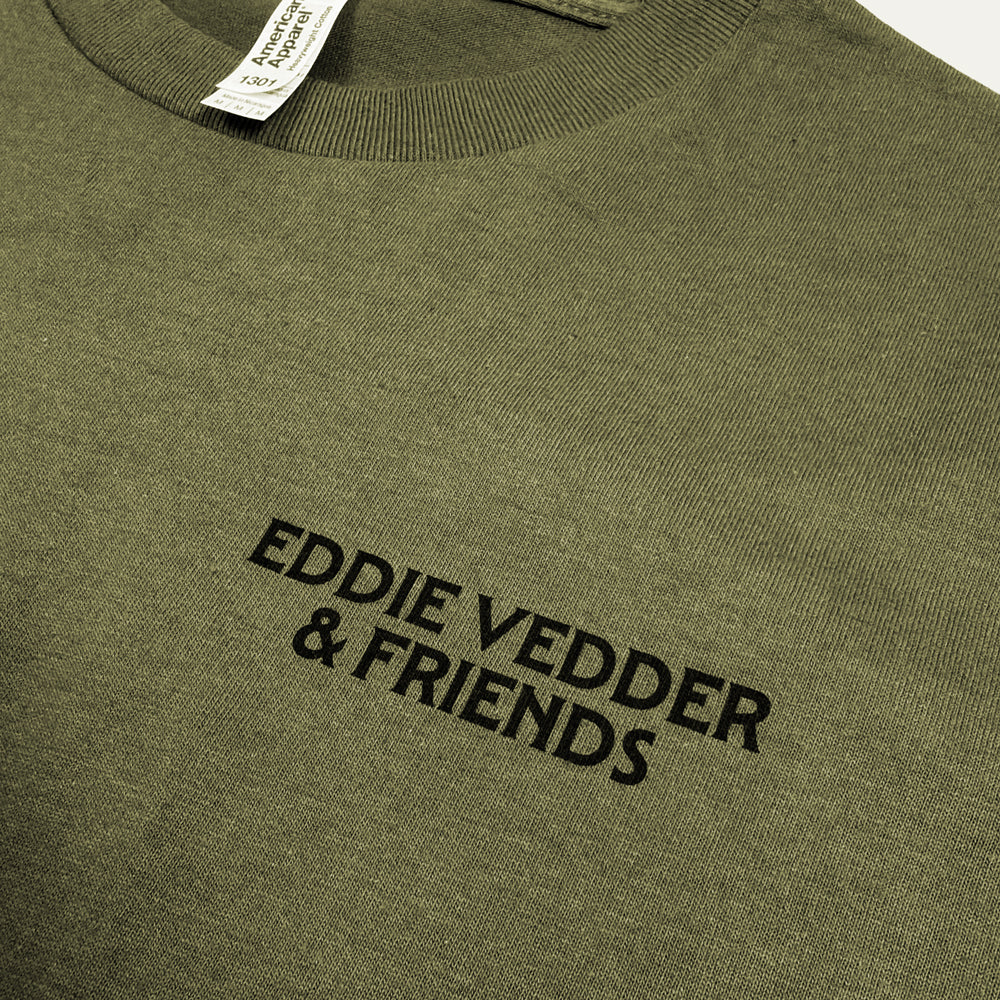 Close-up of black Eddie Vedder & Friends chest print on military green Wings Tee