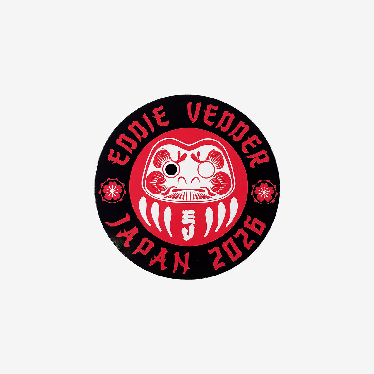 A red and black circular logo with Daruma doll design and 'Eddie Vedder Japan 2026' text on a white background
