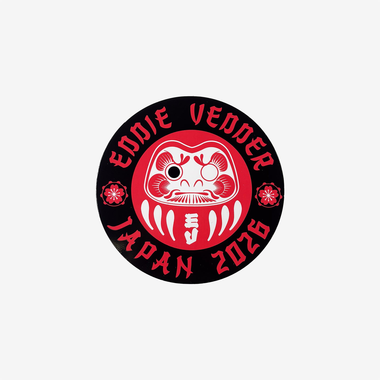 A red and black circular logo with Daruma doll design and 'Eddie Vedder Japan 2026' text on a white background