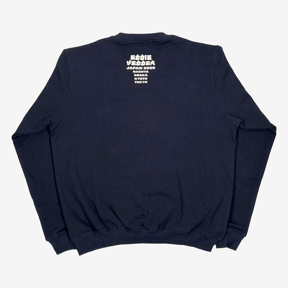 Navy blue crewneck sweatshirt with white text on the back reading "Eddie Vedder Japan 2026, Nagoya, Osaka, Kyoto, Tokyo" against a white background