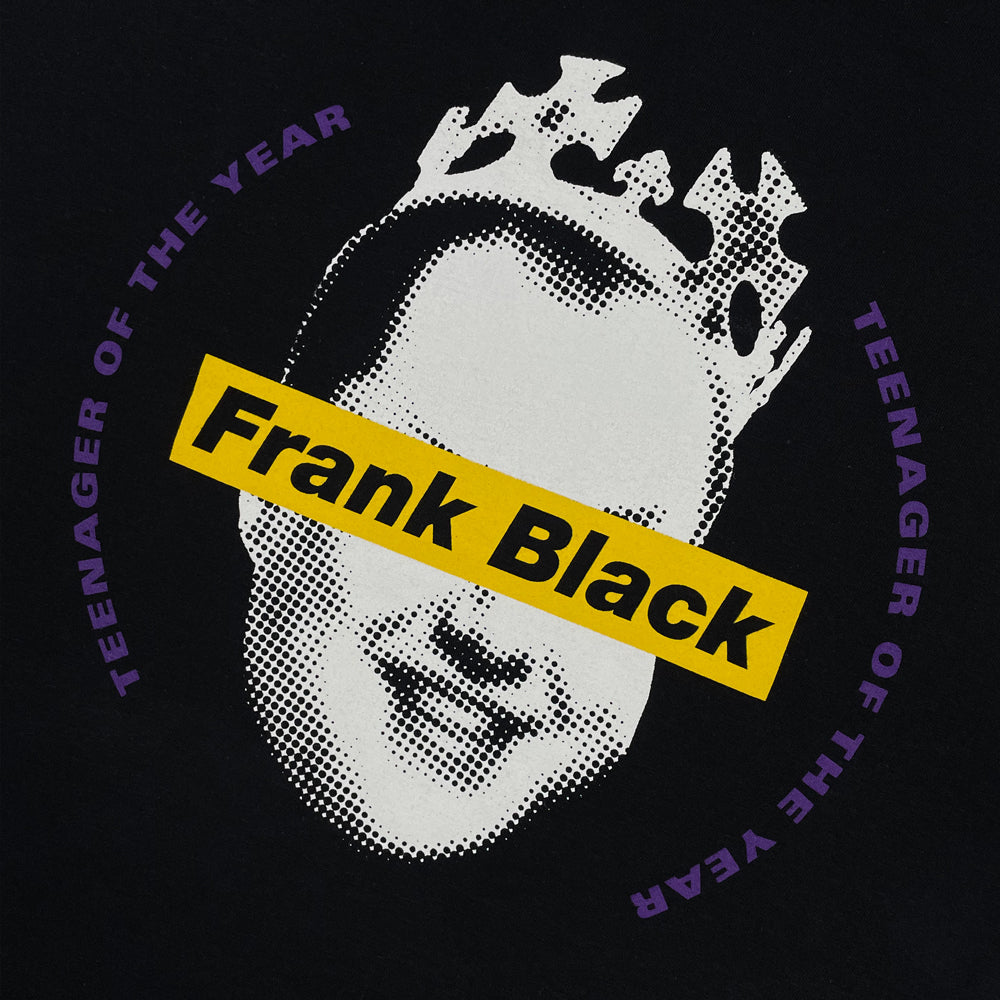Close up of a black Frank Black t-shirt front print with image of Frank Black behind text reading "FRANK BLACK" surrounded by the worlds "Teenager of the year"
