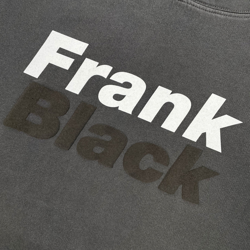 Close up of a grey Frank Black sweatshirt with black and white lettering reading "Frank Black"