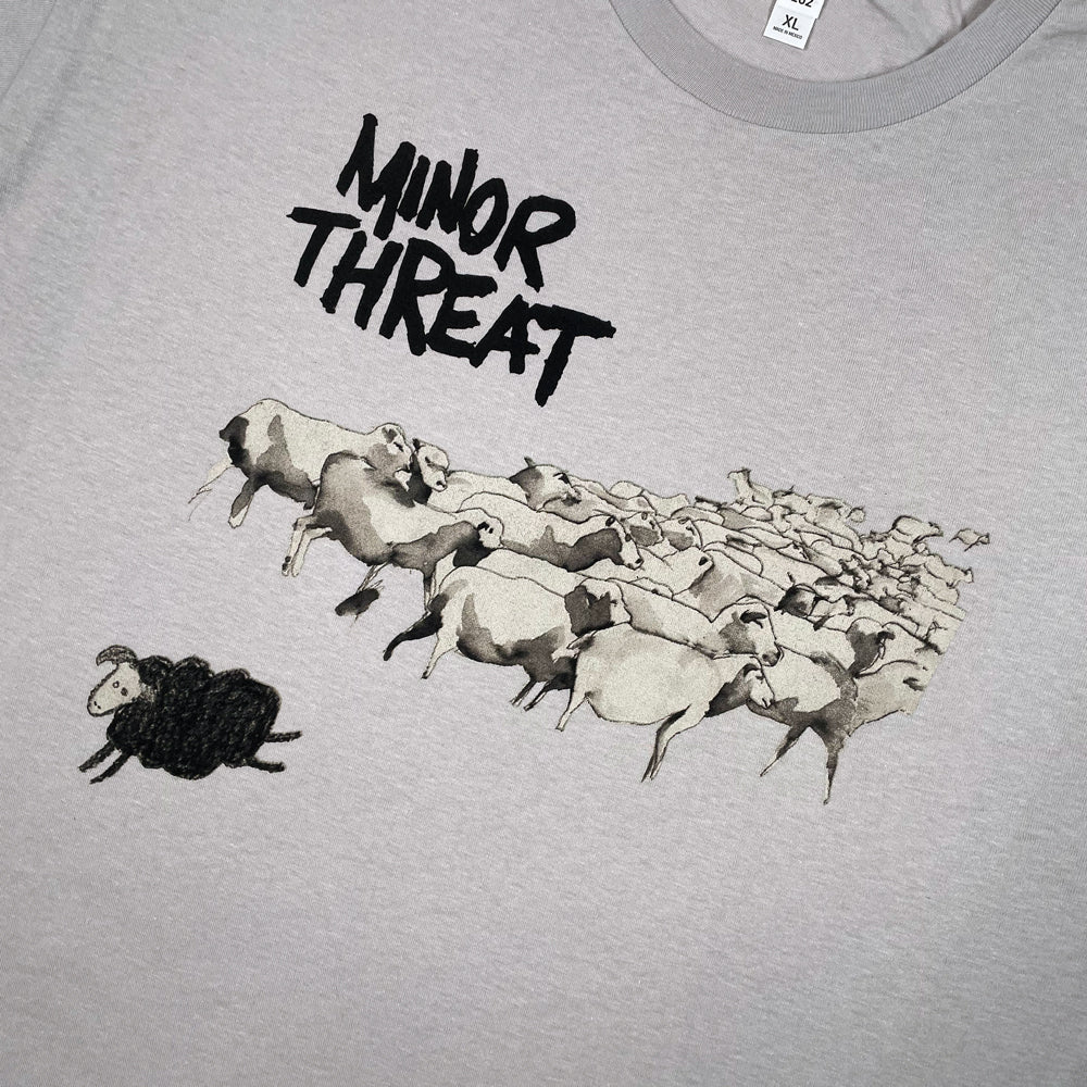 Close up of a  Minor Threat Tee featuring the album cover art from the Still out of Step EP