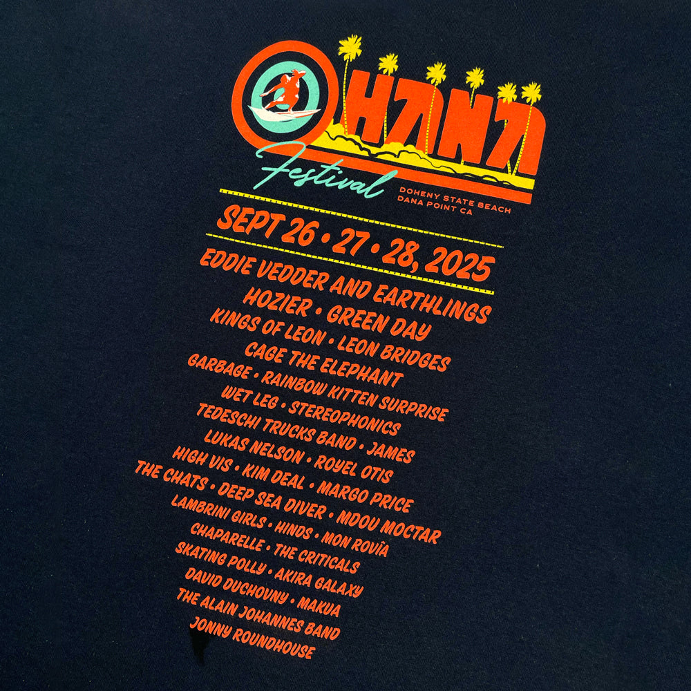Close up of a navy Ohana Festival t-shirt from the back displaying a list of all bands from the 2025 festival and the logo reading "OHANA FESTIVAL DOHENY STATE BEACH DANA POINT, CA"