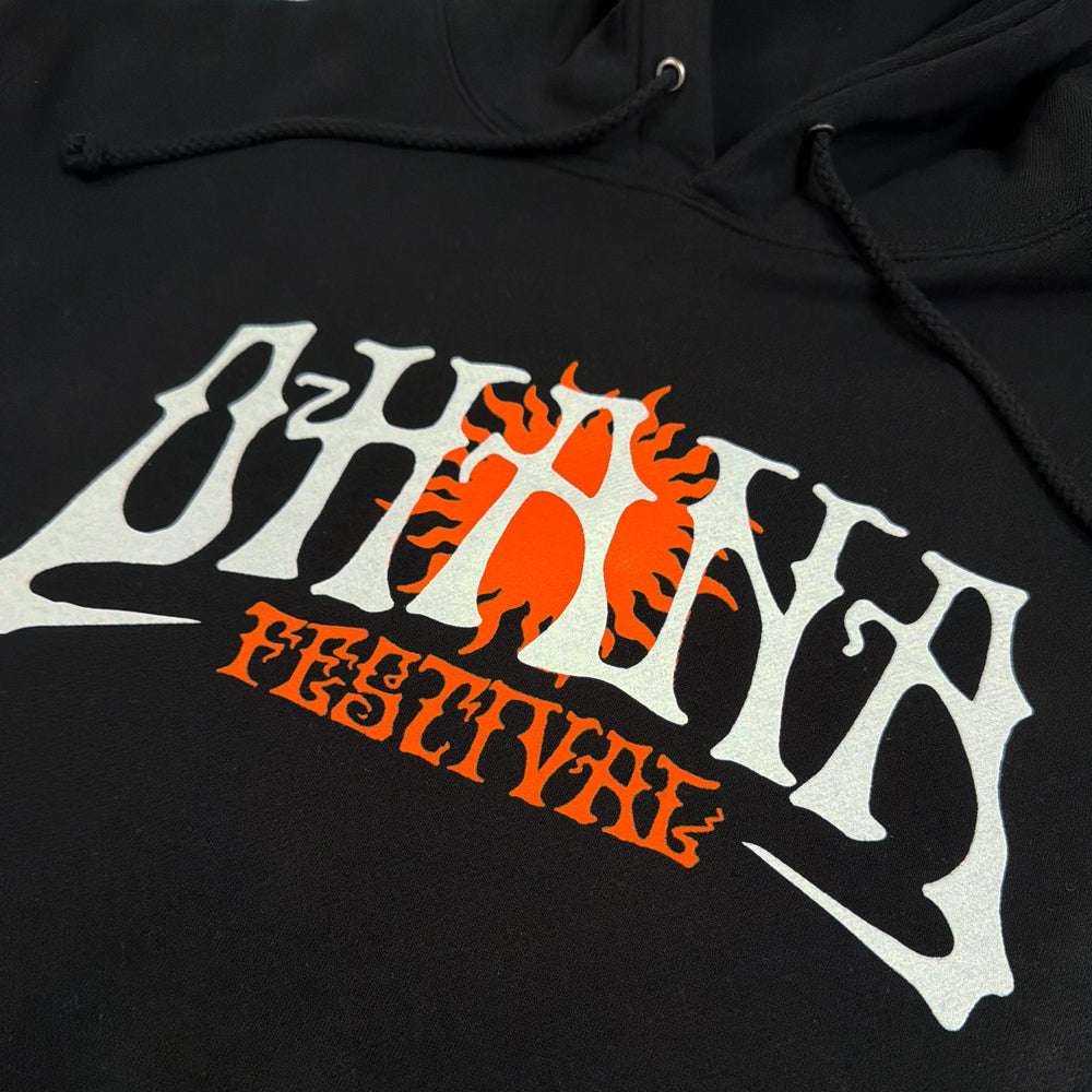 Close-up of white Ohana lettering and an orange sun on the black Acid Wave Hoodie.