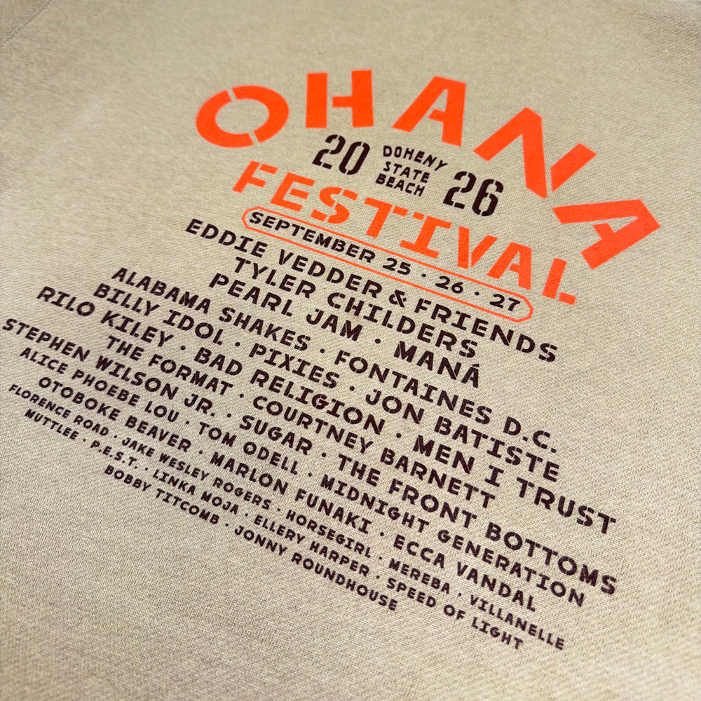 Close-up of orange Ohana Festival lettering, 2026 event details, and the black lineup on the hoodie’s back.