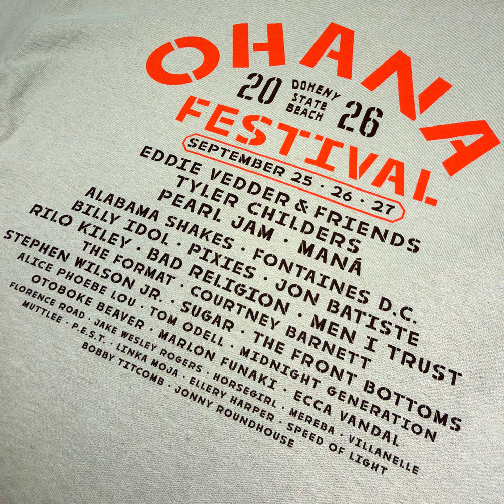Close-up of the festival lineup, September 25–27 dates, and orange Ohana lettering on the sand tee’s back.