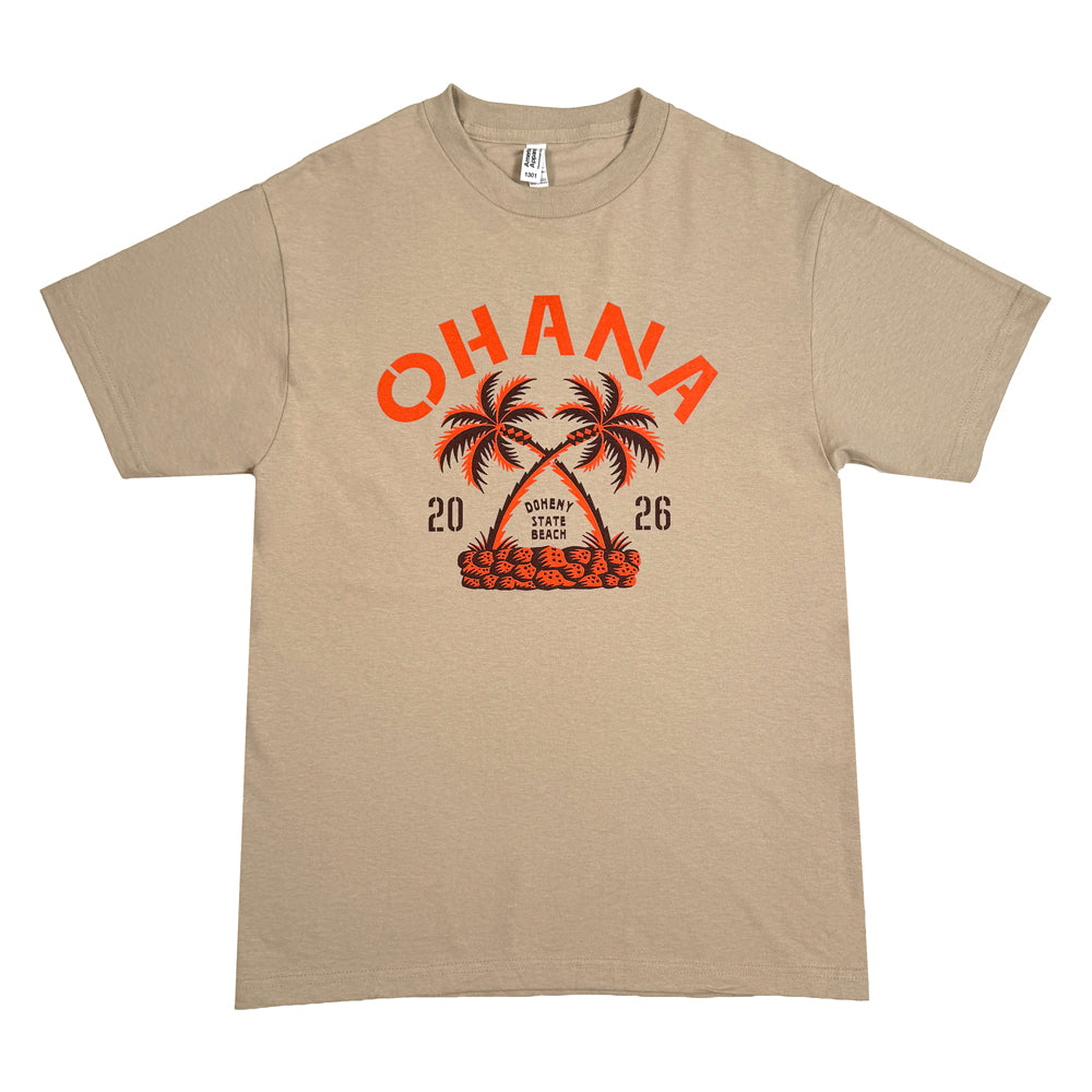 Sand Ohana Crossed Palms Tee with orange-and-black palm trees, Ohana lettering, and 2026 numerals.