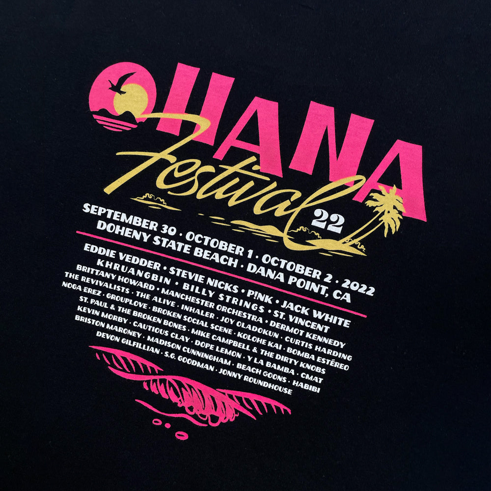 Close up of a black Ohana Festival tee back print with typography in the shape of a heart. Logo reads "Ohana Festival 22" followed by the dates of the festival and a list of every band which played at the event