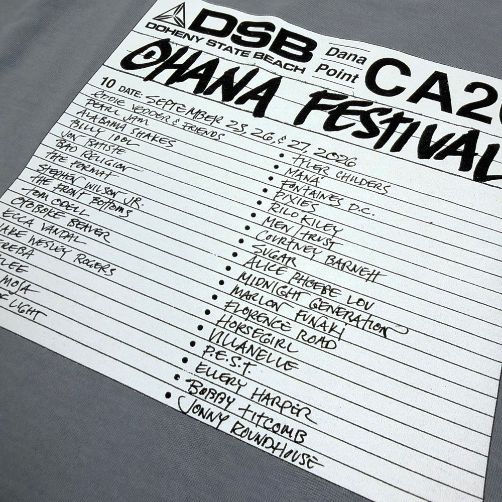 Close-up of the handwritten-style Ohana Festival lineup and event dates on the tee’s white back graphic.