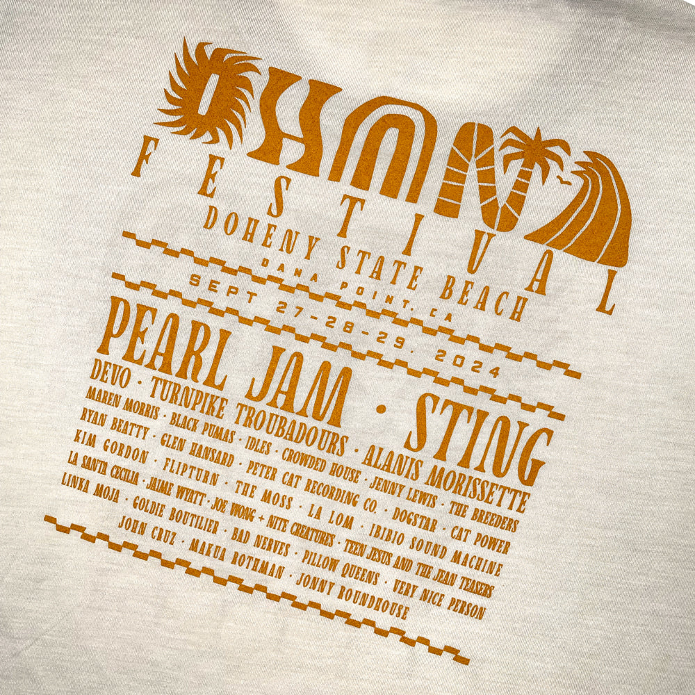 Close up of a beige Ohana Festival t-shirt back print with text reading "Ohana Festival Doheny State Beach Dana Point, CA" followed by the list of bands from the festival
