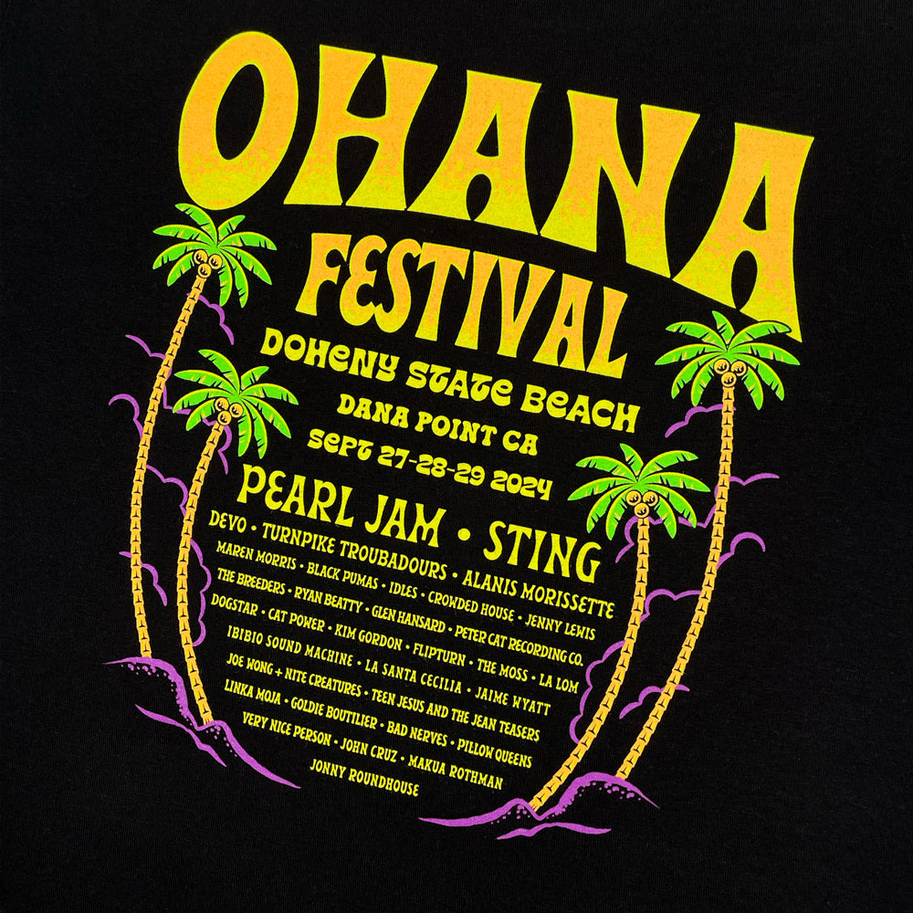 Close up of a black t-shirt back print with yellow text reading "Ohana Festival Doheny State Beach Dana Point CA Sept 27-28-29 2024" followed by a list of bands from the festival
