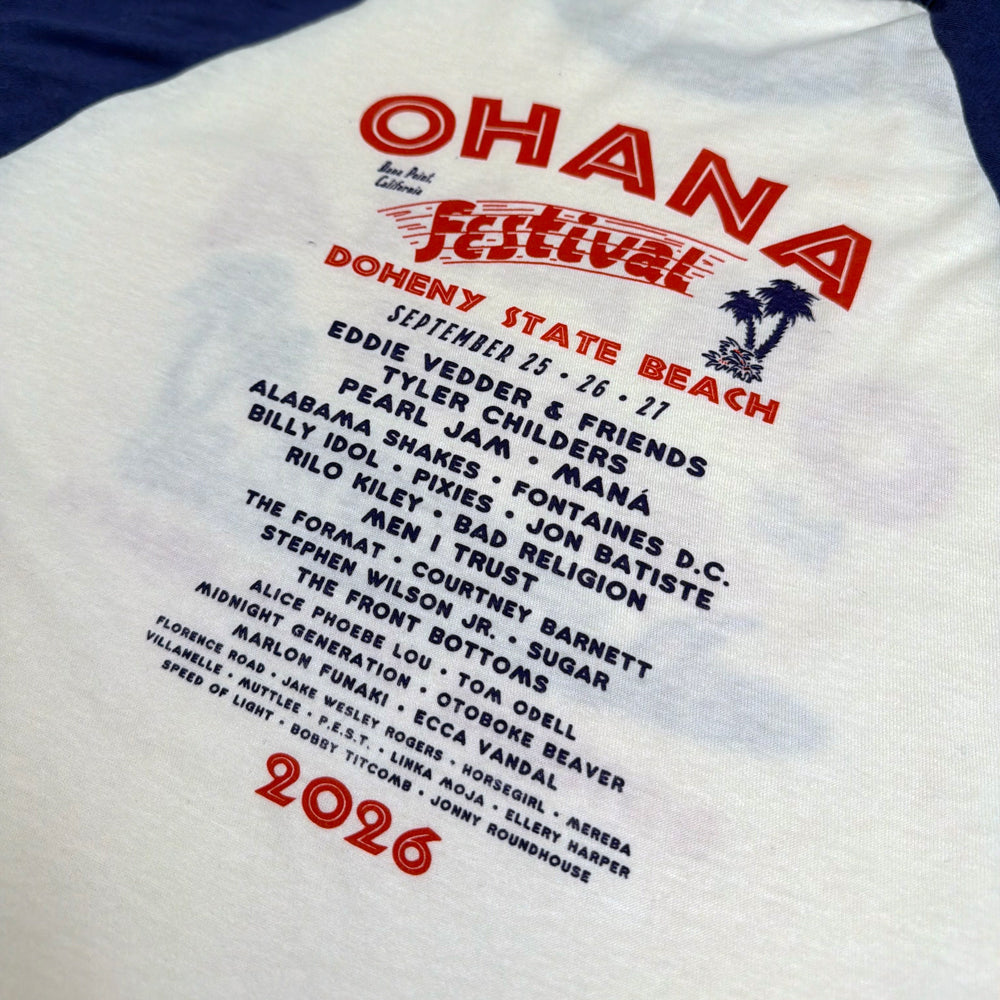 Close-up of red Ohana lettering, the blue artist lineup, and 2026 event details on the Surf Meet Tee’s back.