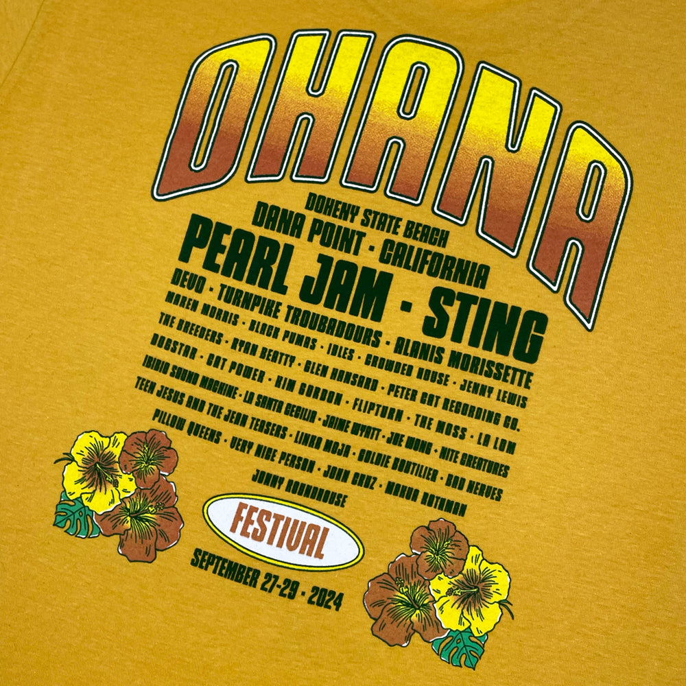A close up of a yellow Ohana Festival t-shirt back print with text reading "Ohana Doheny State Beach Dana Point California" followed by the list of bands from the 2024 festival