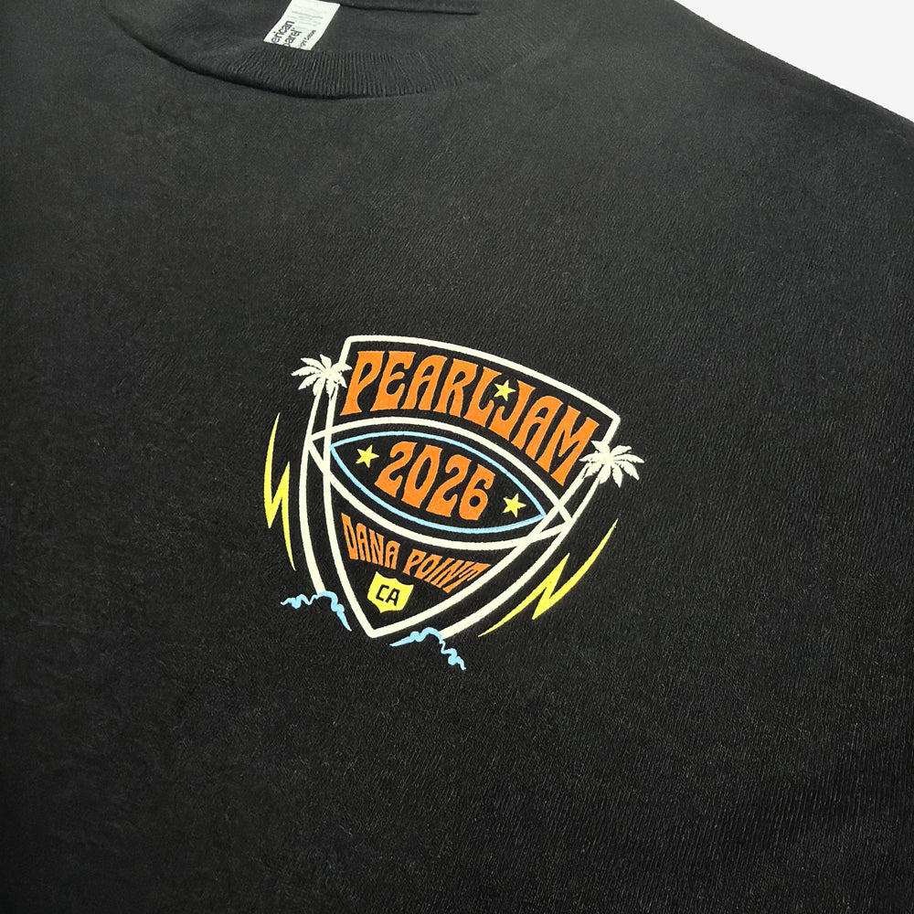 Close-up of multicolor Pearl Jam 2026 Dana Point chest graphic on black Big Kahuna Tee