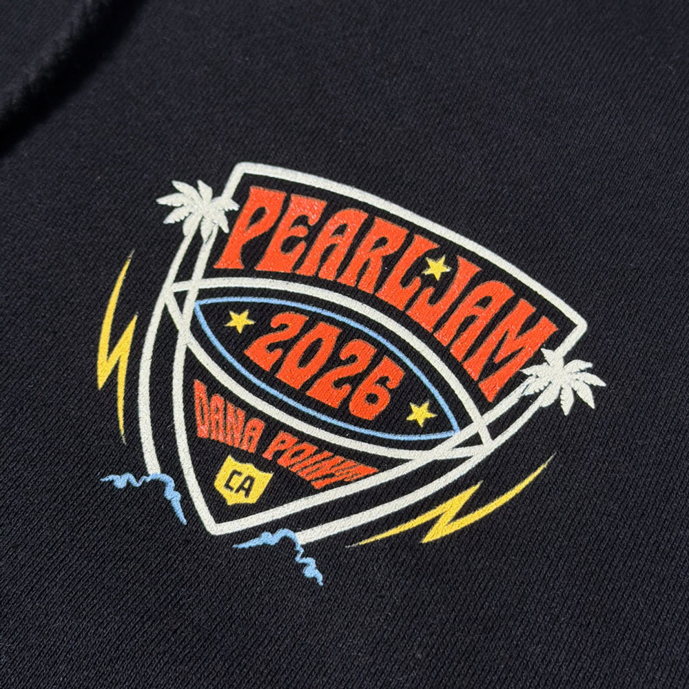 Close-up of multicolor Pearl Jam 2026 Dana Point chest graphic on black zip hoodie