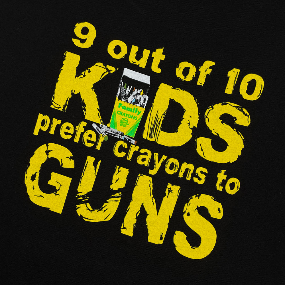 Close up of a Pearl Jam Choices Tee back print with yellow typography reading "9 out of 10 kids prefer crayons to guns"