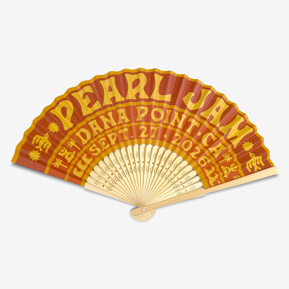 Open Pearl Jam Golden Hour Hand Fan with orange and yellow Dana Point event artwork and natural wood ribs