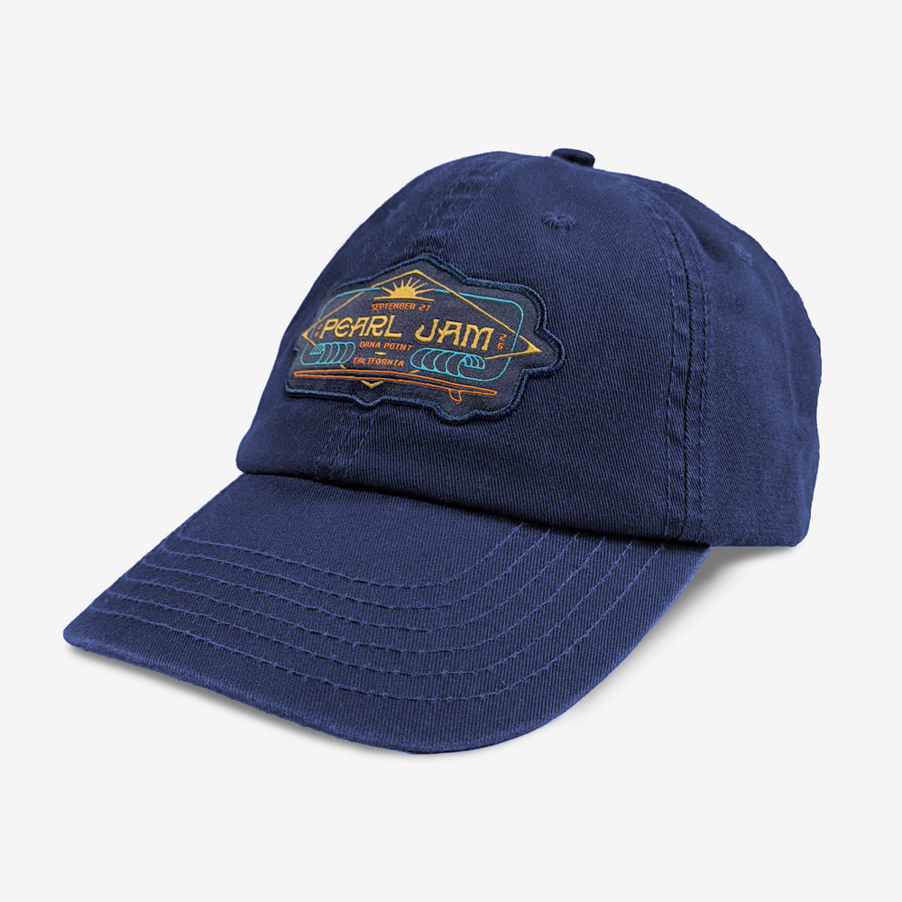 Pearl Jam South Swell Dad Hat in navy blue featuring an embroidered Dana Point surf-inspired patch and curved bill.