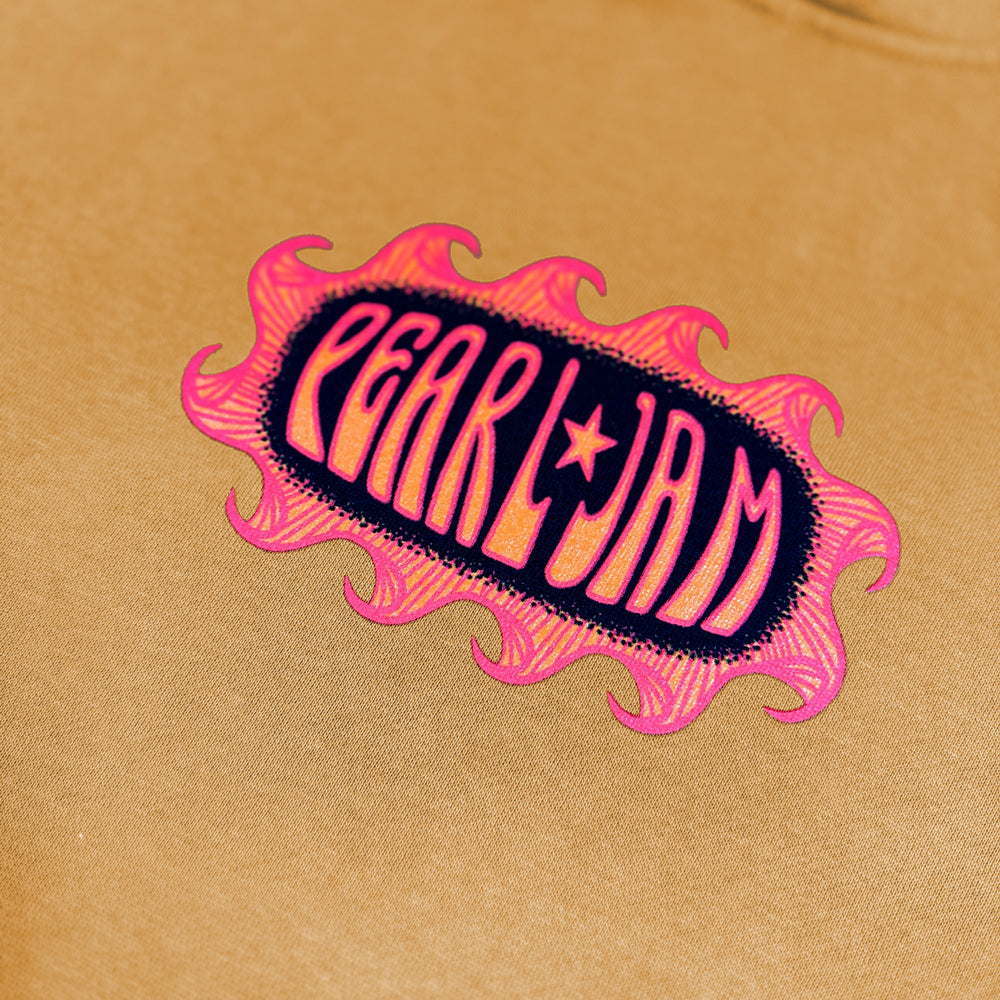 Close-up of pink and navy Pearl Jam graphic on peanut butter pullover hoodie