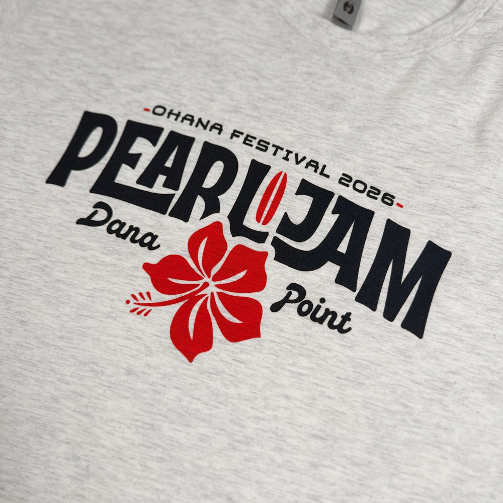 Close-up of navy Pearl Jam lettering and red hibiscus graphic on oatmeal Surf Shack Tee