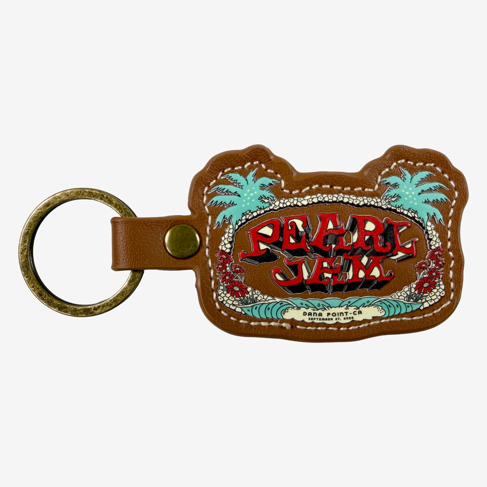 Pearl Jam Wild Palms Keychain featuring tropical artwork, brown leather finish, contrast stitching, and metal key ring.