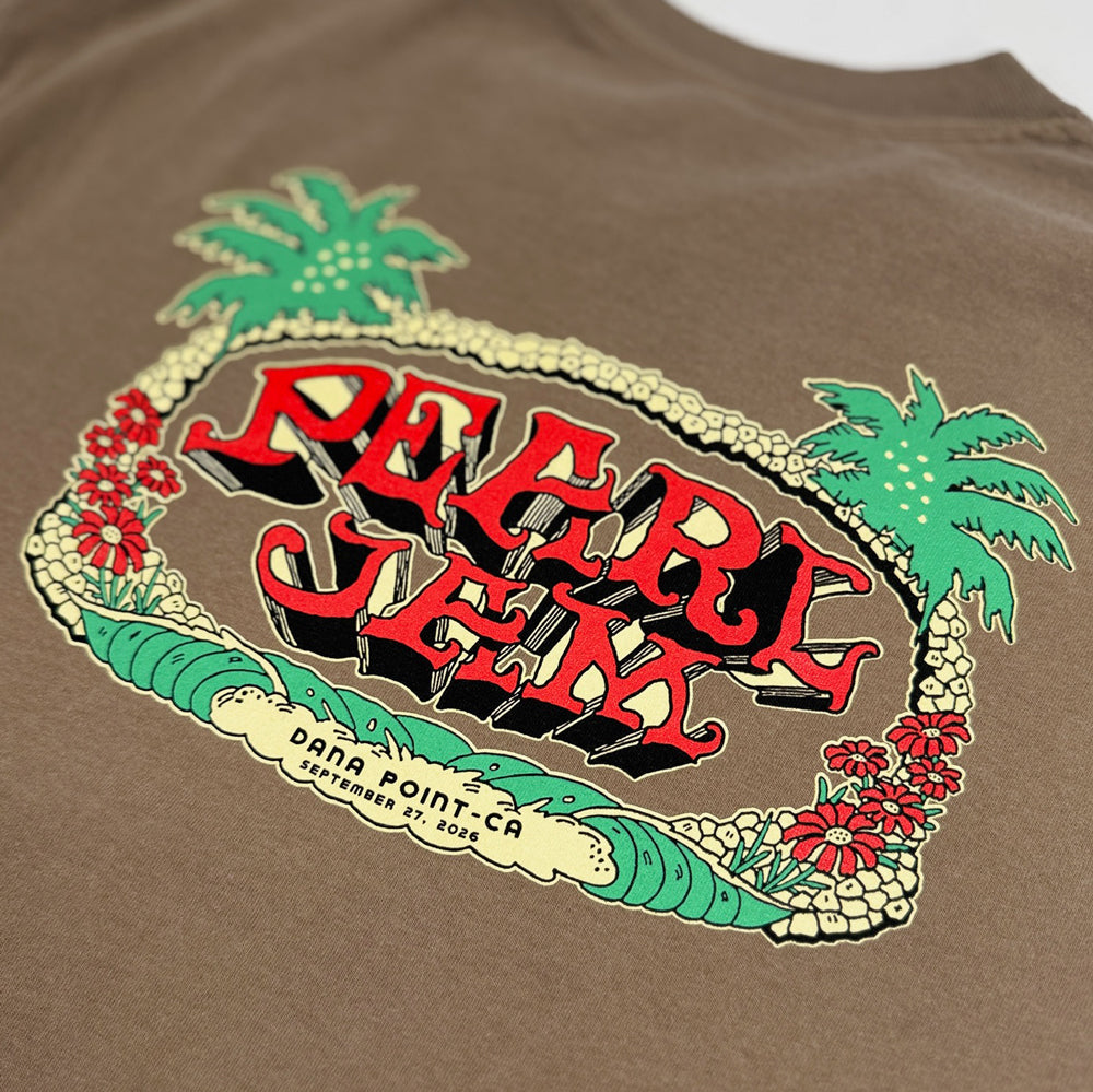 Close-up of Pearl Jam Wild Palms graphic with palm trees, flowers, waves, and Dana Point details
