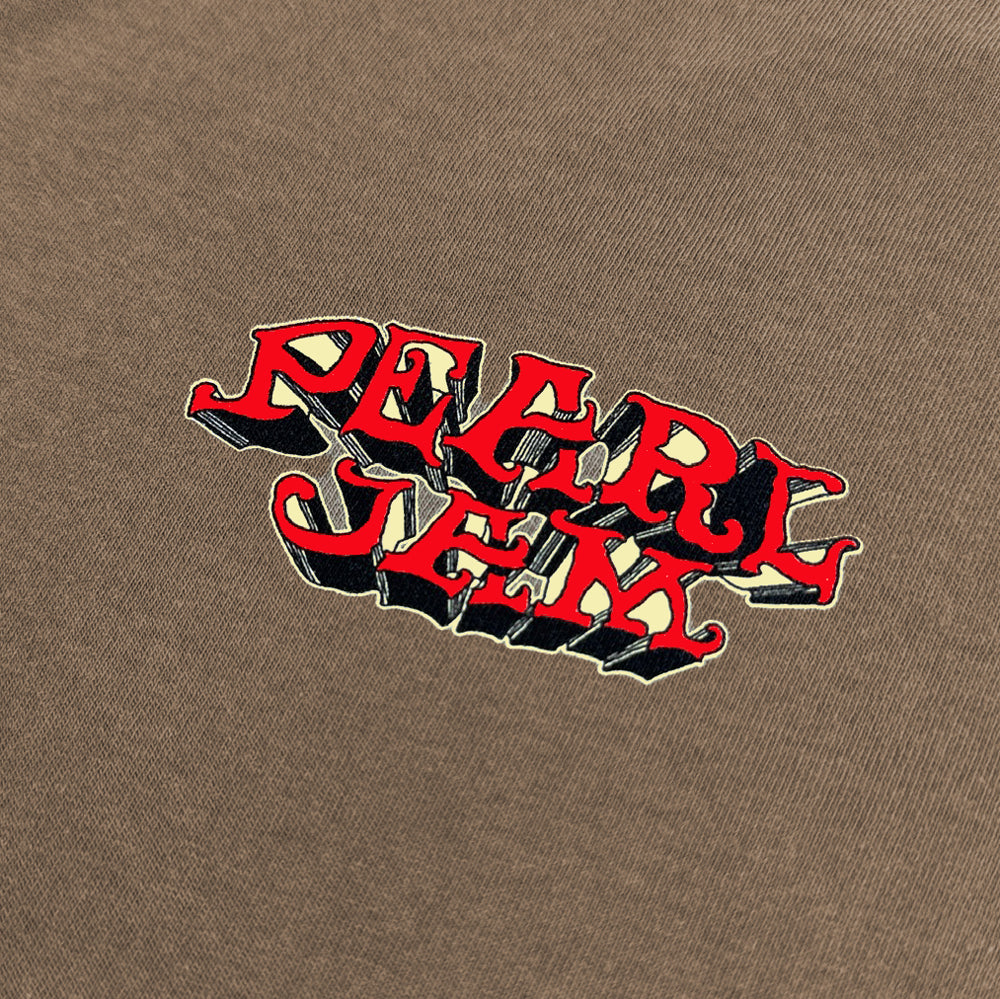 Close-up of navy Pearl Jam lettering and red hibiscus graphic on oatmeal Surf Shack Tee