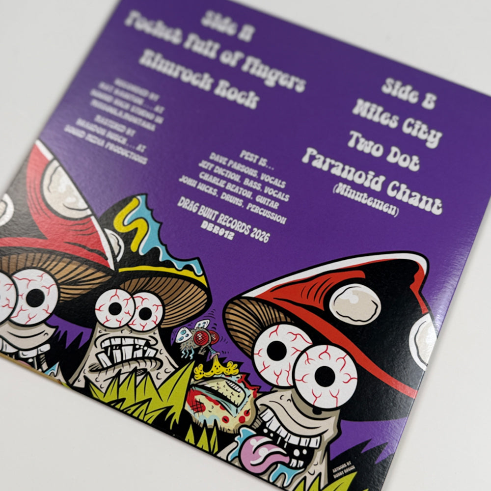 Angled close-up of P.E.S.T. EP 4 back sleeve showing track listings and cartoon skeleton artwork