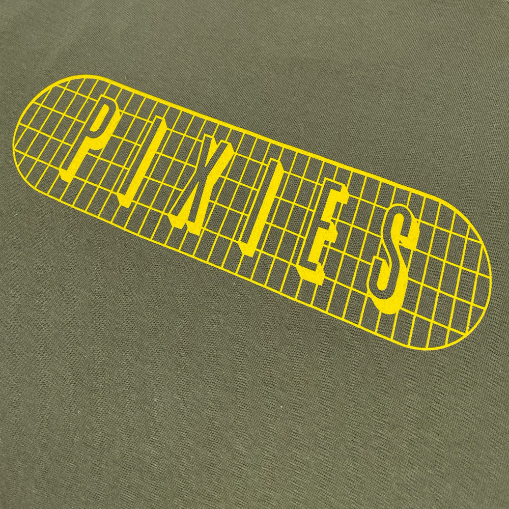 A close up of a military green t shirt featuring a yellow grid design with "Pixies" text written inside.