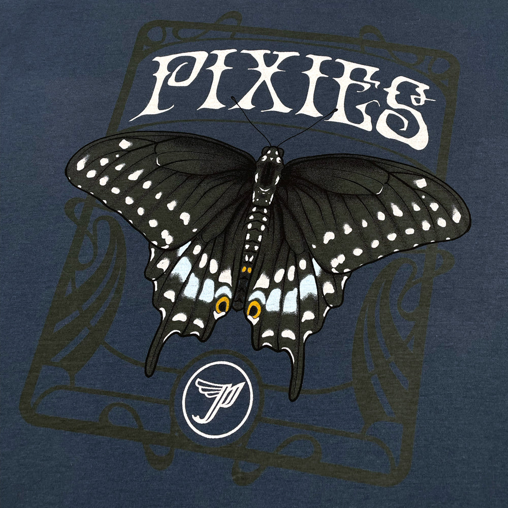 Close up of a navy blue women's t-shirt with a butterfly graphic and cream text reading "Pixies." Below the butterfly is a Pixies "Circle P Logo" in cream.